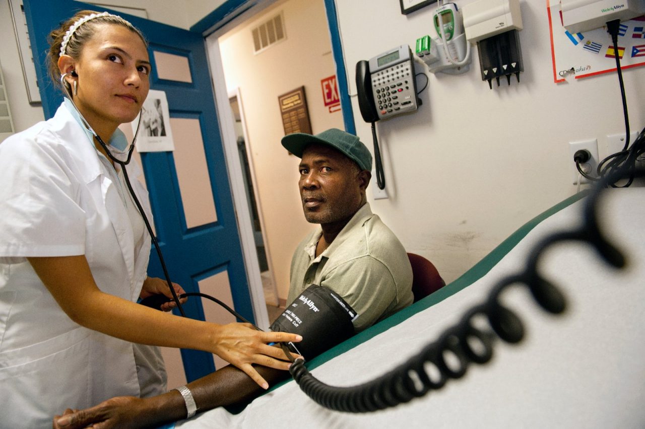 Nurse, Paola Diaz checks the blood pressure of farm worker and diabetic patient, Michael, at the Hudson River Health Care Migrant clinic in New Paltz, NY.  Rural Health Care.